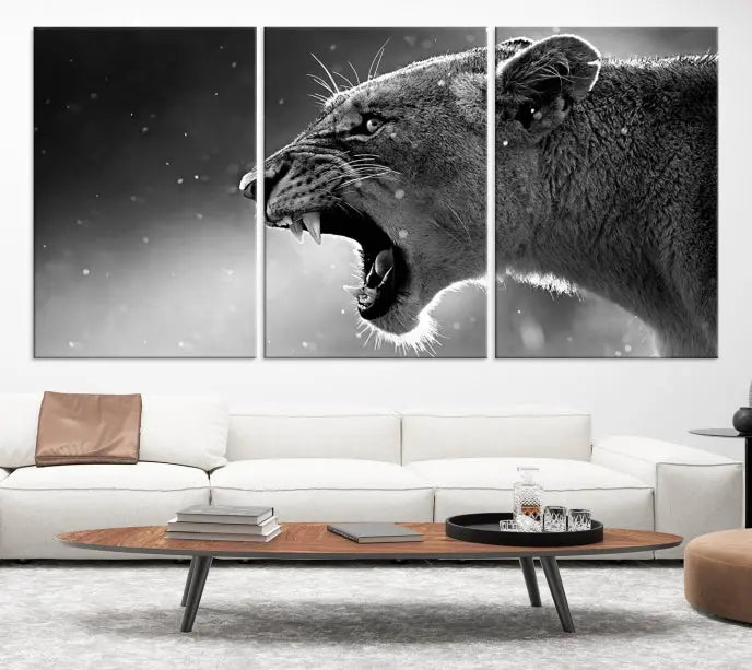 A Lion Wall Art Canvas Print depicting a roaring lioness in black and white, expertly gallery wrapped with UV-protective coating, is displayed in the living room.