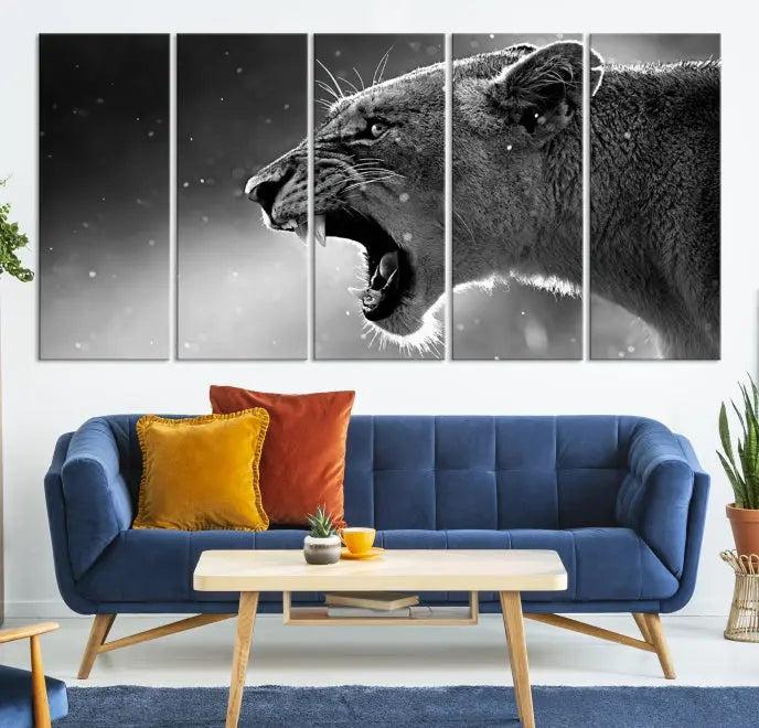 A Lion Wall Art Canvas Print depicting a roaring lioness in black and white, expertly gallery wrapped with UV-protective coating, is displayed in the living room.