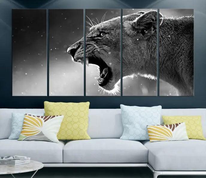 A Lion Wall Art Canvas Print depicting a roaring lioness in black and white, expertly gallery wrapped with UV-protective coating, is displayed in the living room.