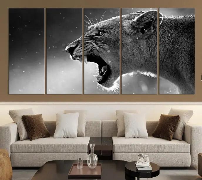 A Lion Wall Art Canvas Print depicting a roaring lioness in black and white, expertly gallery wrapped with UV-protective coating, is displayed in the living room.