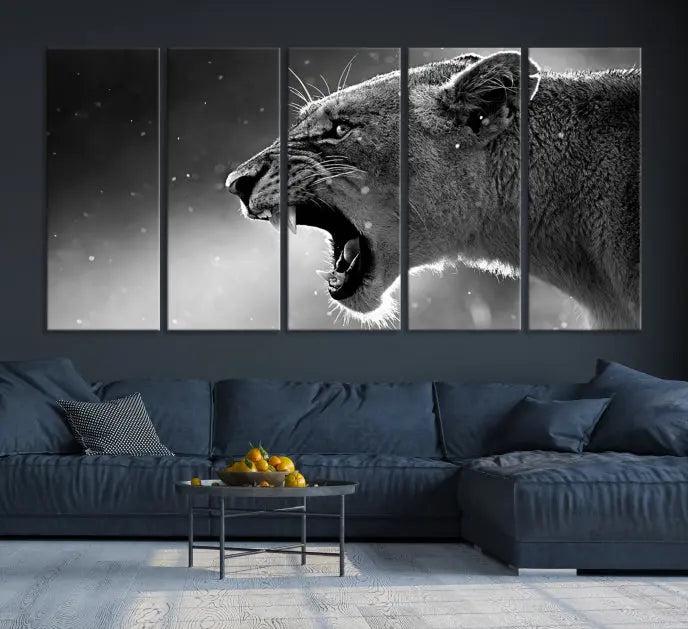 A Lion Wall Art Canvas Print depicting a roaring lioness in black and white, expertly gallery wrapped with UV-protective coating, is displayed in the living room.