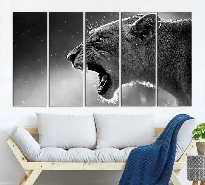 A Lion Wall Art Canvas Print depicting a roaring lioness in black and white, expertly gallery wrapped with UV-protective coating, is displayed in the living room.