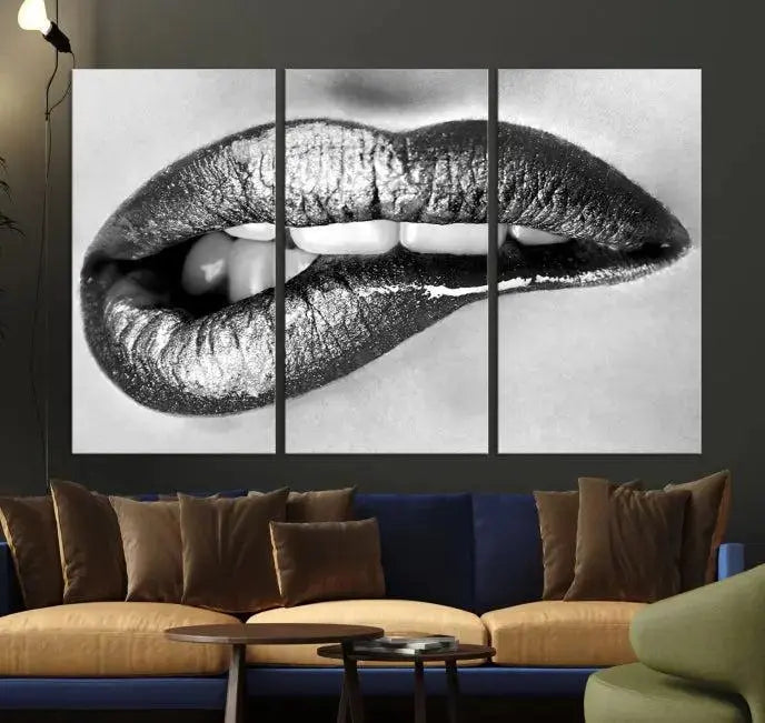 A striking triptych of Lip Bite Wall Art Canvas Print, featuring glossy metallic lips, gleams against a black background. Its UV-protective coating guarantees enduring vibrancy.