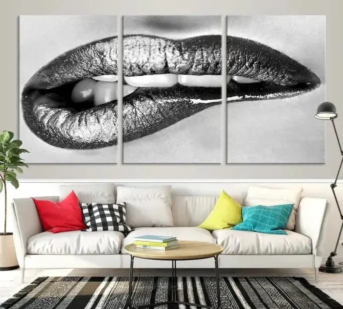 A striking triptych of Lip Bite Wall Art Canvas Print, featuring glossy metallic lips, gleams against a black background. Its UV-protective coating guarantees enduring vibrancy.