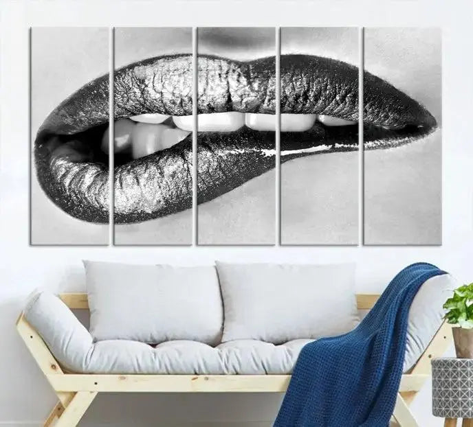 A striking triptych of Lip Bite Wall Art Canvas Print, featuring glossy metallic lips, gleams against a black background. Its UV-protective coating guarantees enduring vibrancy.