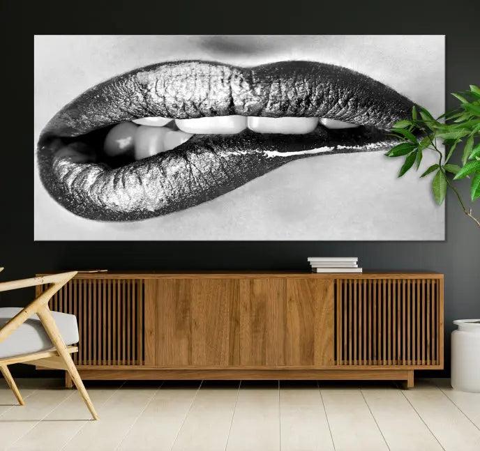 A striking triptych of Lip Bite Wall Art Canvas Print, featuring glossy metallic lips, gleams against a black background. Its UV-protective coating guarantees enduring vibrancy.