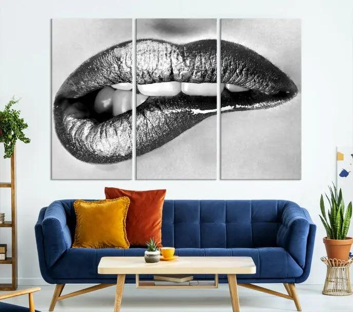 A striking triptych of Lip Bite Wall Art Canvas Print, featuring glossy metallic lips, gleams against a black background. Its UV-protective coating guarantees enduring vibrancy.