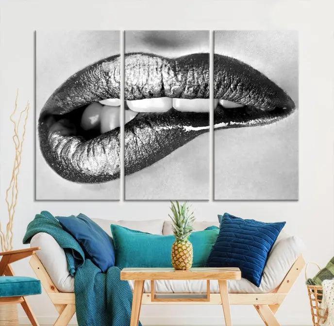 A striking triptych of Lip Bite Wall Art Canvas Print, featuring glossy metallic lips, gleams against a black background. Its UV-protective coating guarantees enduring vibrancy.