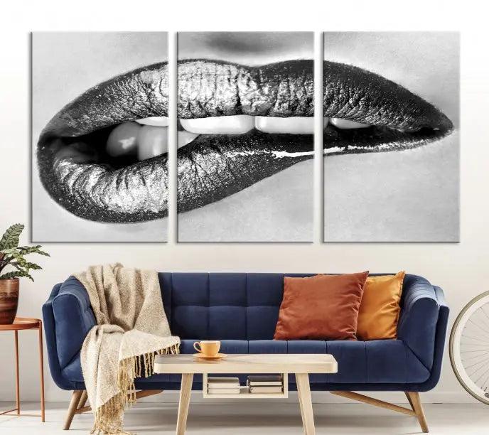 A striking triptych of Lip Bite Wall Art Canvas Print, featuring glossy metallic lips, gleams against a black background. Its UV-protective coating guarantees enduring vibrancy.