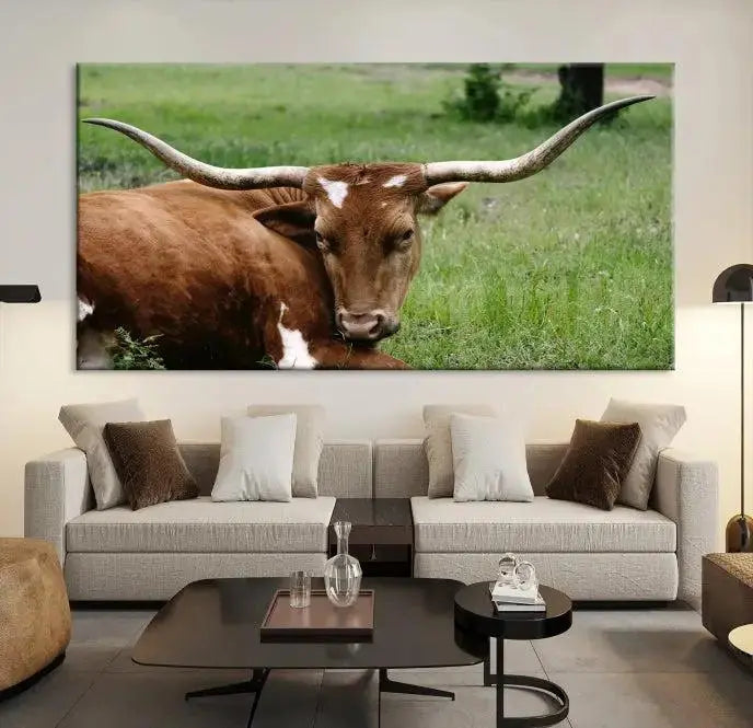 A triptych of the Longhorn Cow Animal Wall Art Canvas Print adorns the wall. These museum-quality canvases are gallery-wrapped and finished with a UV-protective coating for lasting beauty.