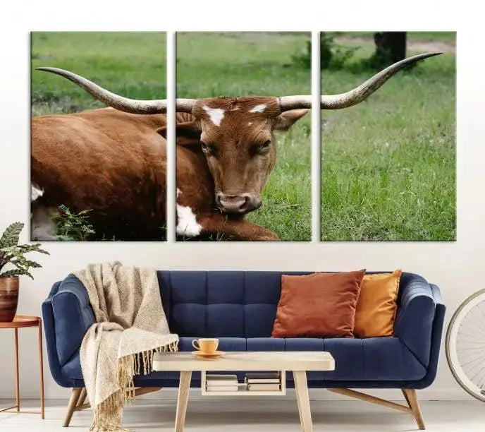 A triptych of the Longhorn Cow Animal Wall Art Canvas Print adorns the wall. These museum-quality canvases are gallery-wrapped and finished with a UV-protective coating for lasting beauty.