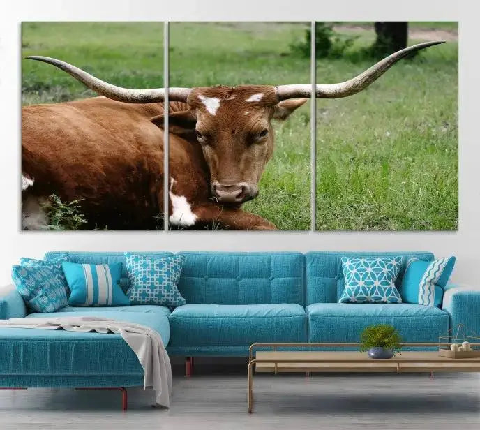 A triptych of the Longhorn Cow Animal Wall Art Canvas Print adorns the wall. These museum-quality canvases are gallery-wrapped and finished with a UV-protective coating for lasting beauty.