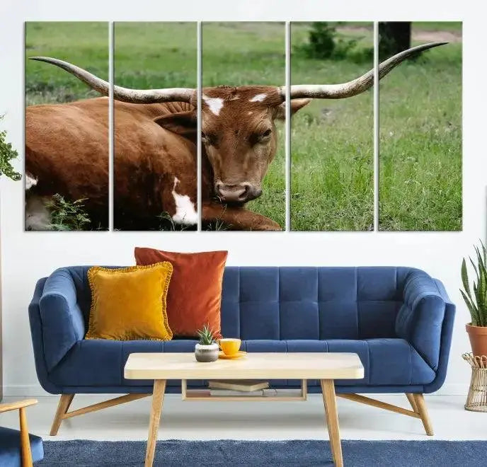 A triptych of the Longhorn Cow Animal Wall Art Canvas Print adorns the wall. These museum-quality canvases are gallery-wrapped and finished with a UV-protective coating for lasting beauty.