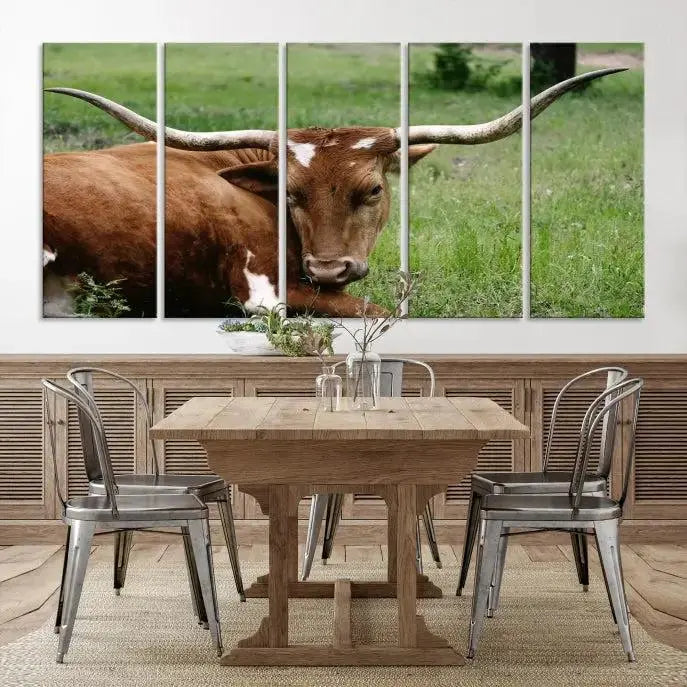 A triptych of the Longhorn Cow Animal Wall Art Canvas Print adorns the wall. These museum-quality canvases are gallery-wrapped and finished with a UV-protective coating for lasting beauty.