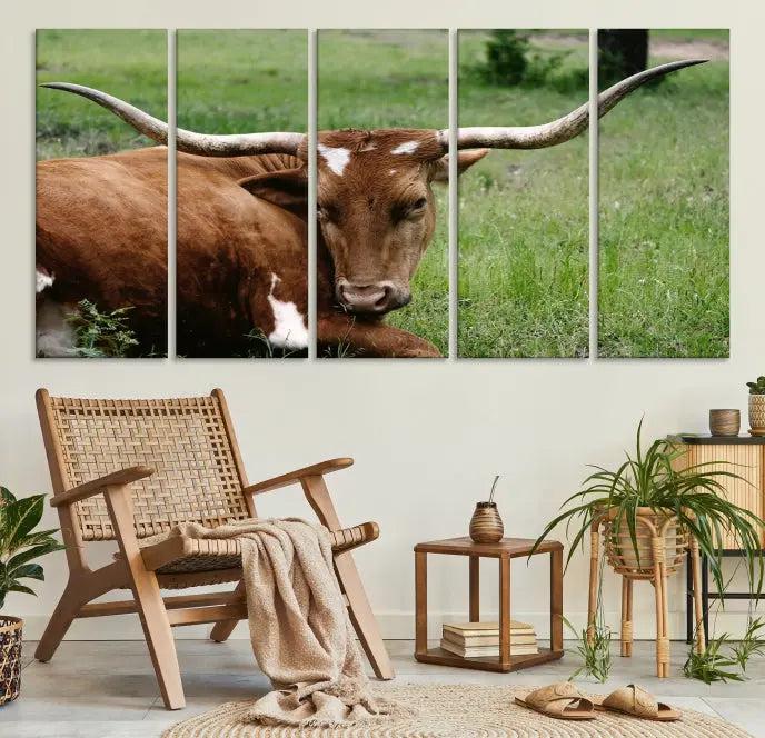 A triptych of the Longhorn Cow Animal Wall Art Canvas Print adorns the wall. These museum-quality canvases are gallery-wrapped and finished with a UV-protective coating for lasting beauty.