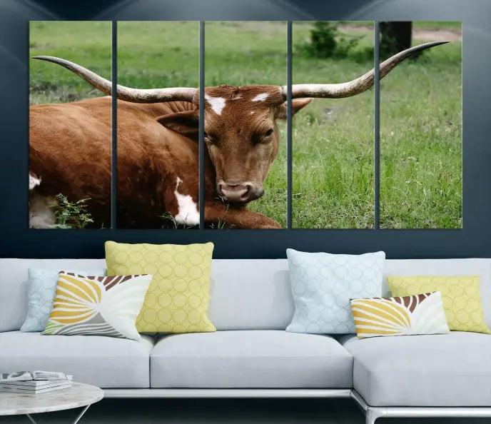 A triptych of the Longhorn Cow Animal Wall Art Canvas Print adorns the wall. These museum-quality canvases are gallery-wrapped and finished with a UV-protective coating for lasting beauty.