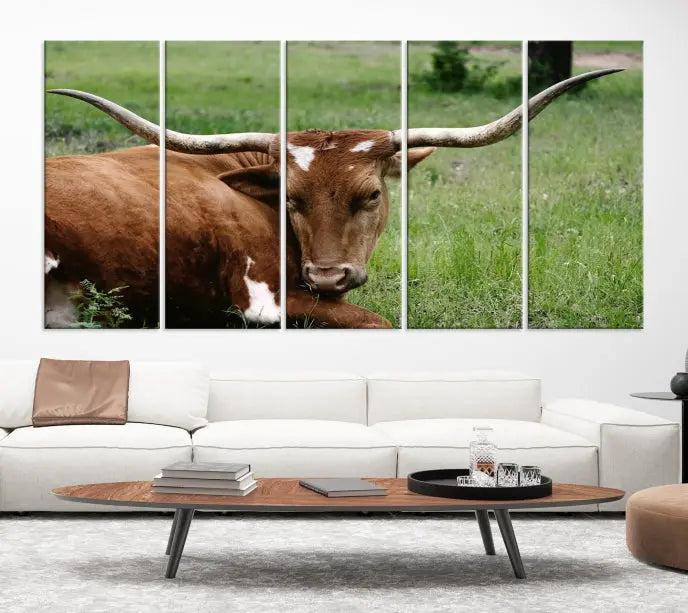 A triptych of the Longhorn Cow Animal Wall Art Canvas Print adorns the wall. These museum-quality canvases are gallery-wrapped and finished with a UV-protective coating for lasting beauty.