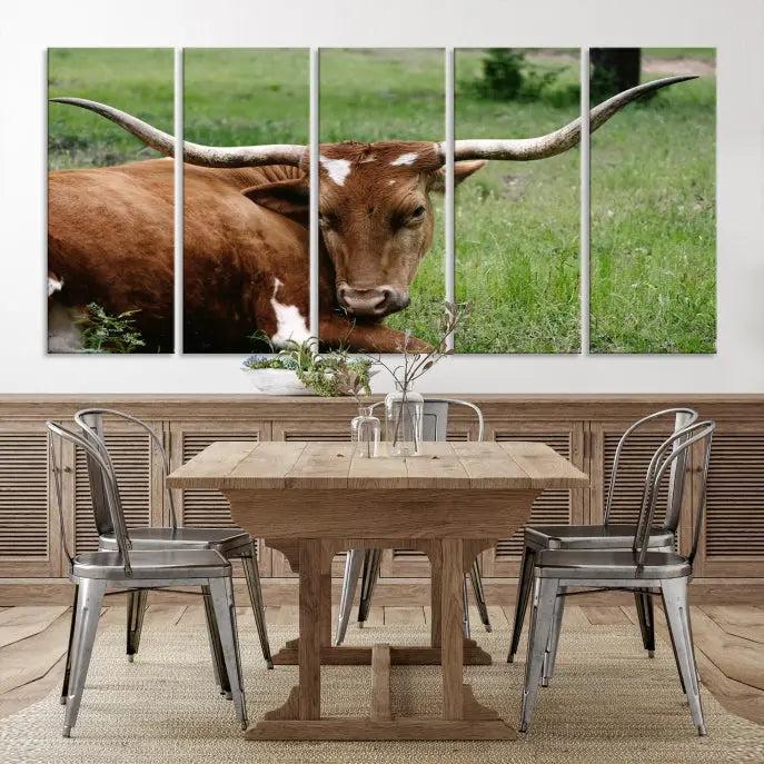 A triptych of the Longhorn Cow Animal Wall Art Canvas Print adorns the wall. These museum-quality canvases are gallery-wrapped and finished with a UV-protective coating for lasting beauty.