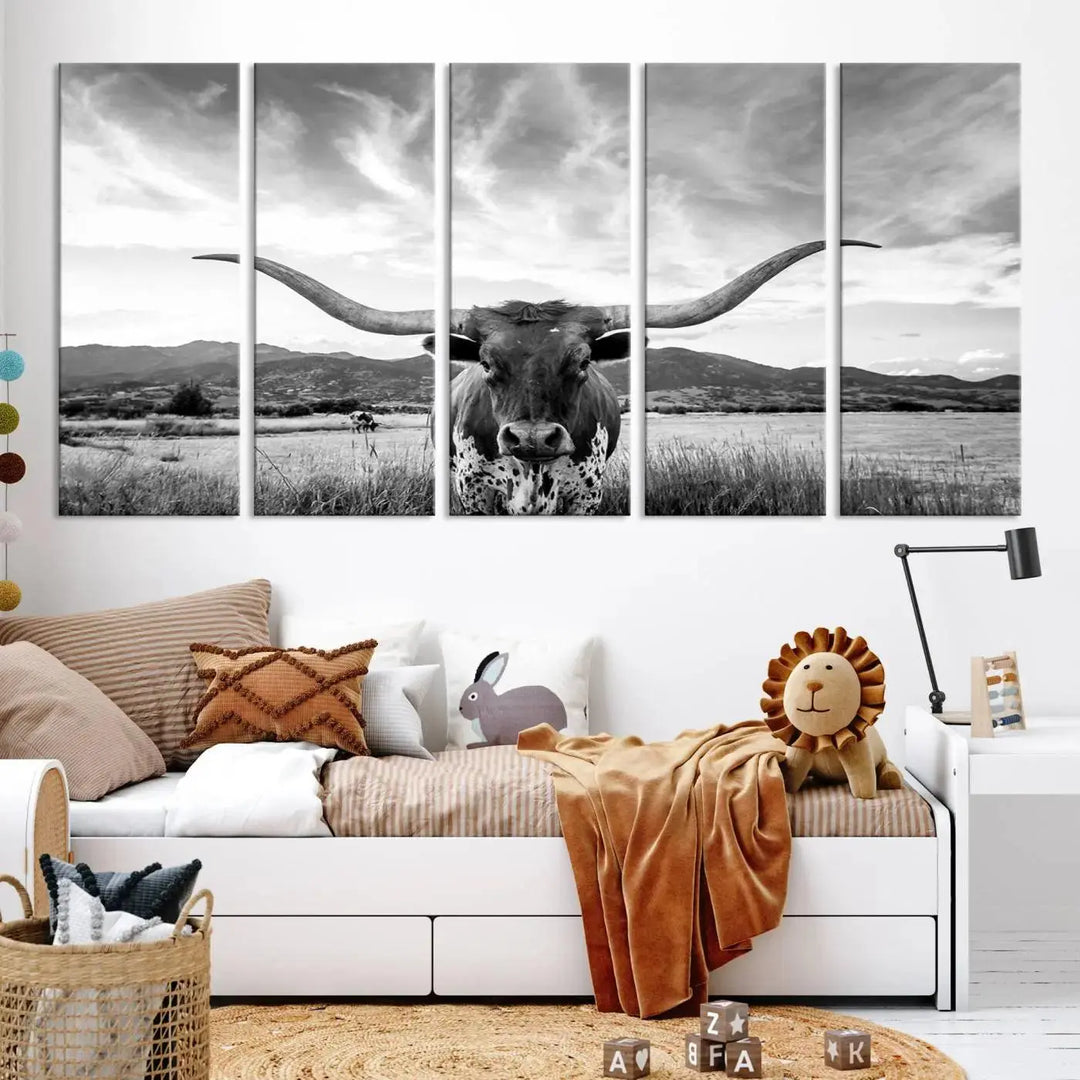 A modern living room showcases a black and white triptych of the "Longhorn Cow Wall Art Canvas Print Farmhouse Wall Art Texas longhorn wall art.