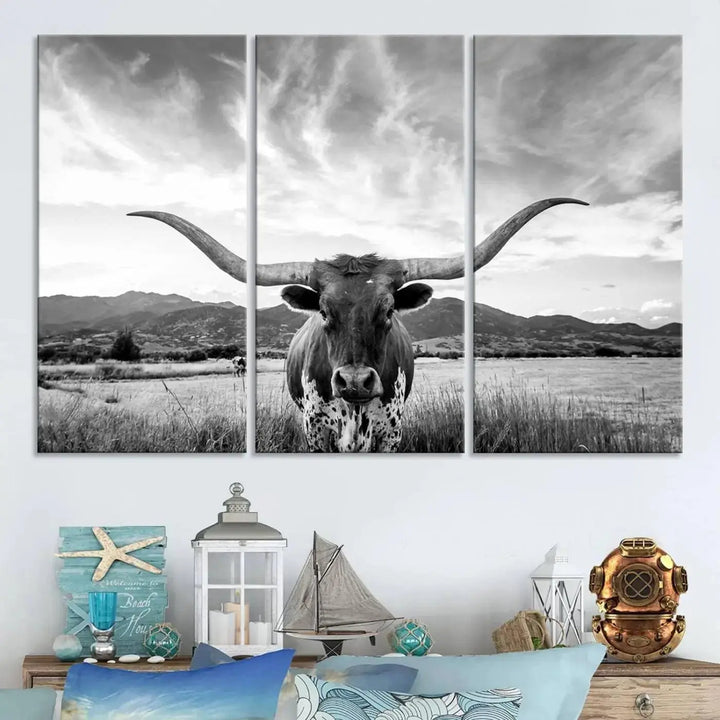 A modern living room showcases a black and white triptych of the "Longhorn Cow Wall Art Canvas Print Farmhouse Wall Art Texas longhorn wall art.