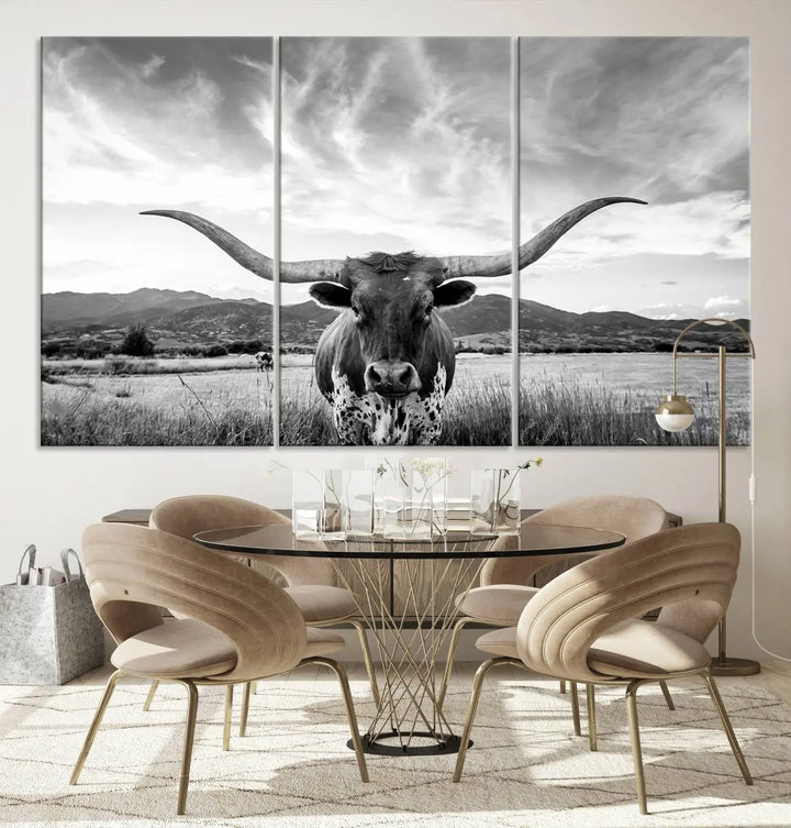 A modern living room showcases a black and white triptych of the "Longhorn Cow Wall Art Canvas Print Farmhouse Wall Art Texas longhorn wall art.