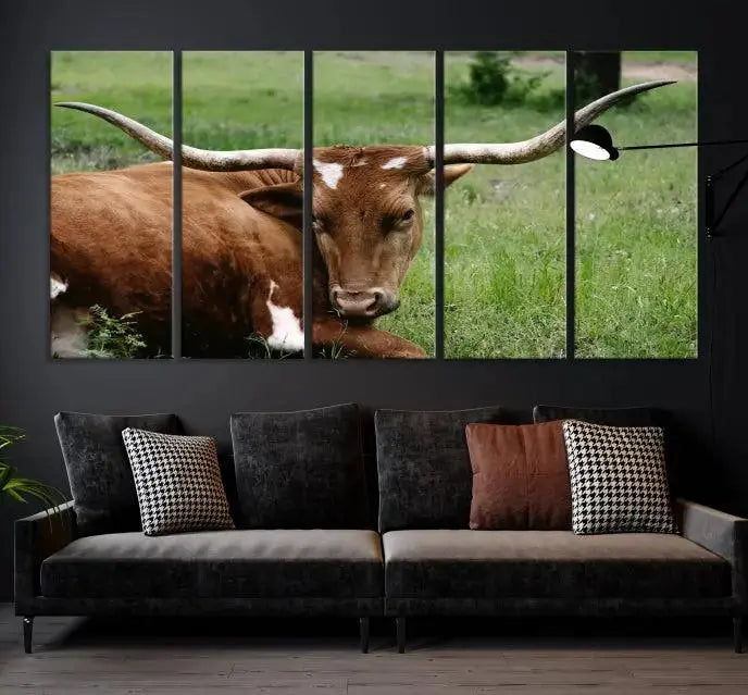 Longhorn steer triptych canvas wall art in a cozy living room setting.