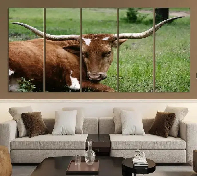 Longhorn steer triptych canvas wall art in a cozy living room setting.