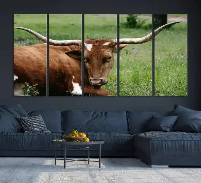Longhorn steer triptych canvas wall art in a cozy living room setting.