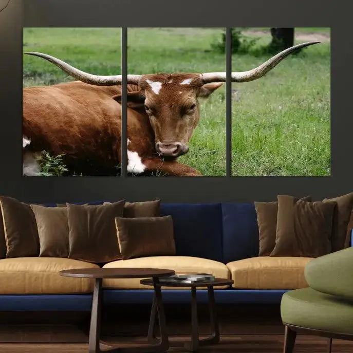 Longhorn steer triptych canvas wall art in a cozy living room setting.