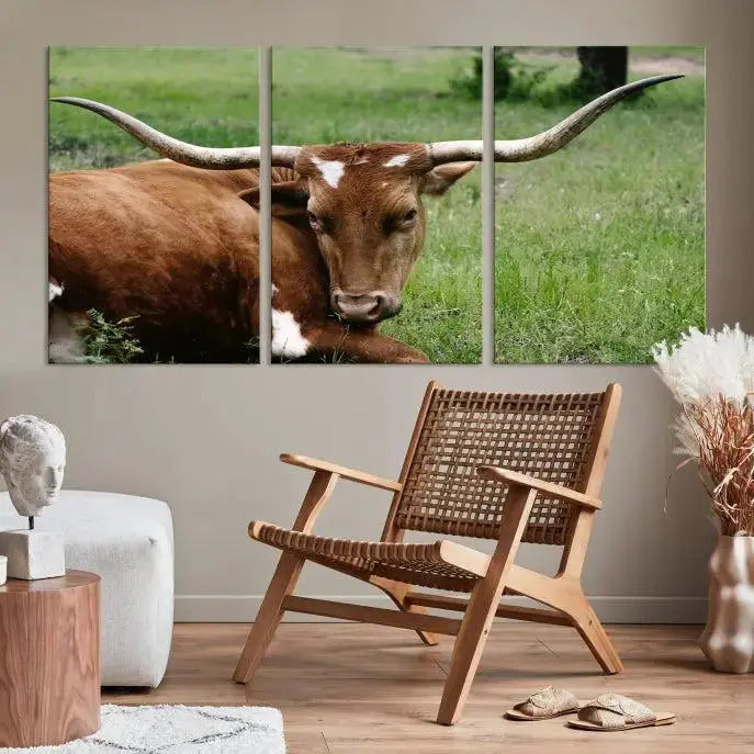 Longhorn steer triptych canvas wall art in a cozy living room setting.