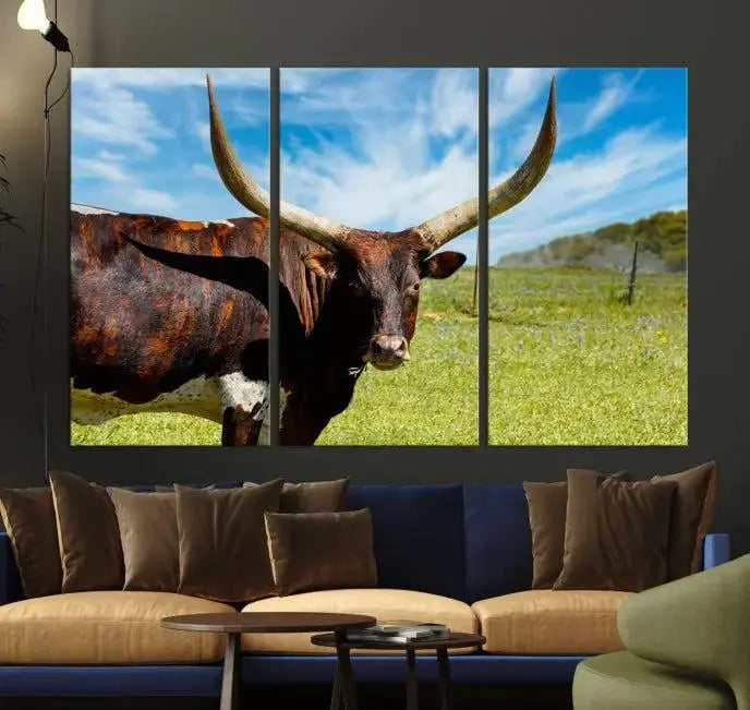 The Longhorn and Cow Wall Art Canvas Print features a triptych of a longhorn cow in a grassy field on a sunny day. These gallery-wrapped, museum-quality canvases are crafted by professional craftsmen to perfectly accentuate the scene, adding an exquisite touch to any living space.