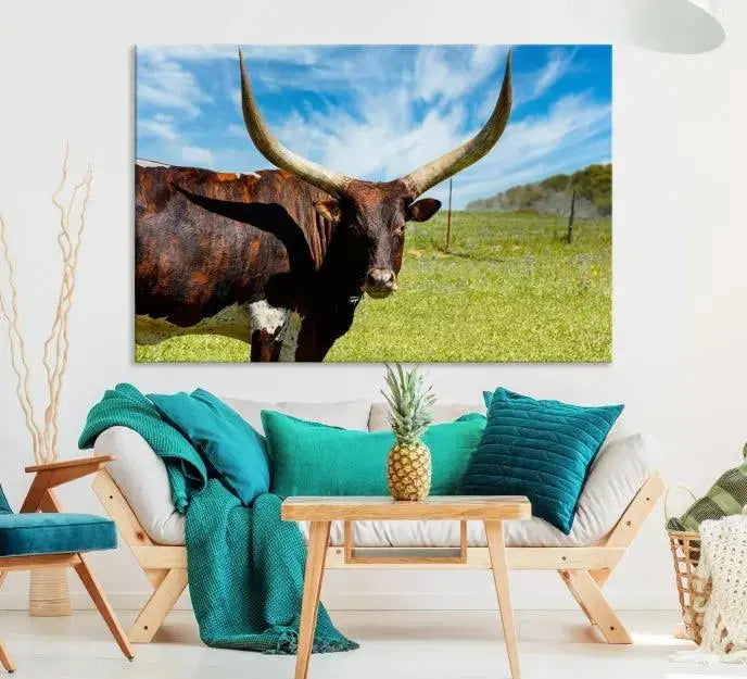 The Longhorn and Cow Wall Art Canvas Print features a triptych of a longhorn cow in a grassy field on a sunny day. These gallery-wrapped, museum-quality canvases are crafted by professional craftsmen to perfectly accentuate the scene, adding an exquisite touch to any living space.