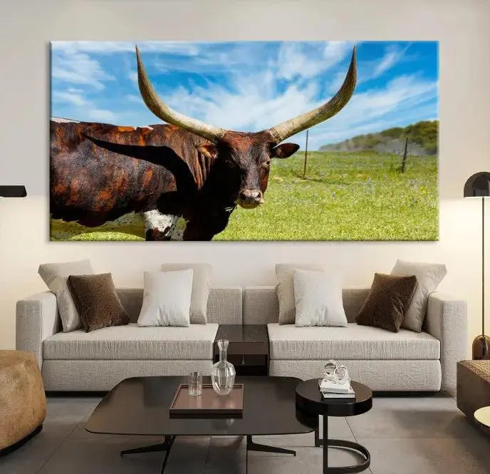 The Longhorn and Cow Wall Art Canvas Print features a triptych of a longhorn cow in a grassy field on a sunny day. These gallery-wrapped, museum-quality canvases are crafted by professional craftsmen to perfectly accentuate the scene, adding an exquisite touch to any living space.