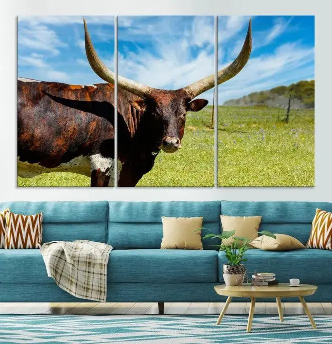 The Longhorn and Cow Wall Art Canvas Print features a triptych of a longhorn cow in a grassy field on a sunny day. These gallery-wrapped, museum-quality canvases are crafted by professional craftsmen to perfectly accentuate the scene, adding an exquisite touch to any living space.