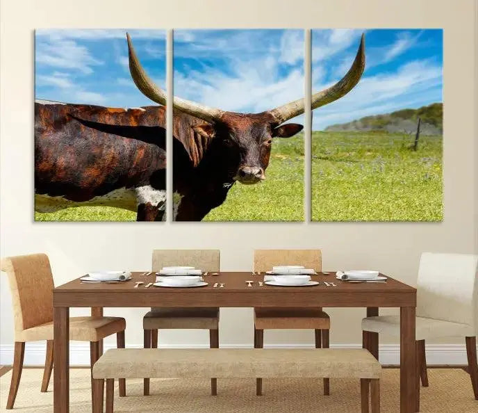 The Longhorn and Cow Wall Art Canvas Print features a triptych of a longhorn cow in a grassy field on a sunny day. These gallery-wrapped, museum-quality canvases are crafted by professional craftsmen to perfectly accentuate the scene, adding an exquisite touch to any living space.