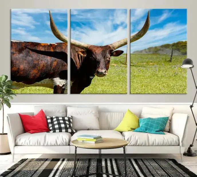 The Longhorn and Cow Wall Art Canvas Print features a triptych of a longhorn cow in a grassy field on a sunny day. These gallery-wrapped, museum-quality canvases are crafted by professional craftsmen to perfectly accentuate the scene, adding an exquisite touch to any living space.