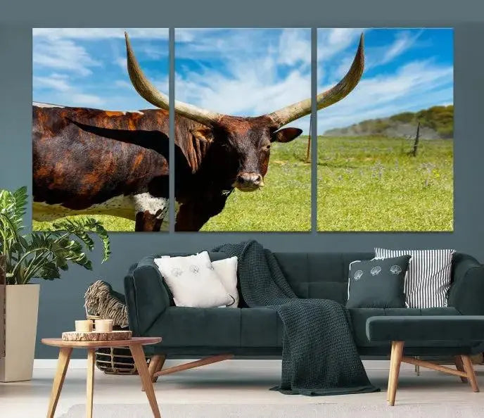 The Longhorn and Cow Wall Art Canvas Print features a triptych of a longhorn cow in a grassy field on a sunny day. These gallery-wrapped, museum-quality canvases are crafted by professional craftsmen to perfectly accentuate the scene, adding an exquisite touch to any living space.