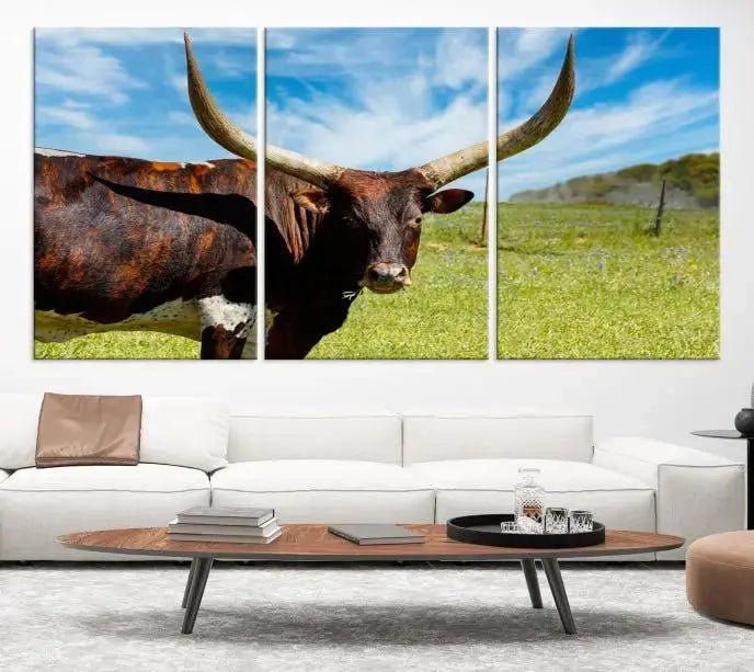 The Longhorn and Cow Wall Art Canvas Print features a triptych of a longhorn cow in a grassy field on a sunny day. These gallery-wrapped, museum-quality canvases are crafted by professional craftsmen to perfectly accentuate the scene, adding an exquisite touch to any living space.