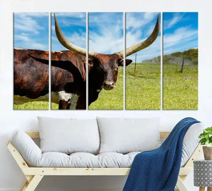 The Longhorn and Cow Wall Art Canvas Print features a triptych of a longhorn cow in a grassy field on a sunny day. These gallery-wrapped, museum-quality canvases are crafted by professional craftsmen to perfectly accentuate the scene, adding an exquisite touch to any living space.