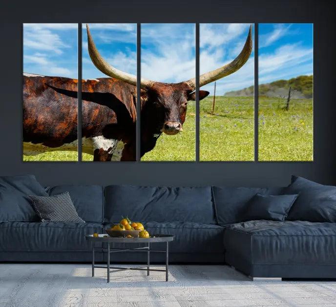 The Longhorn and Cow Wall Art Canvas Print features a triptych of a longhorn cow in a grassy field on a sunny day. These gallery-wrapped, museum-quality canvases are crafted by professional craftsmen to perfectly accentuate the scene, adding an exquisite touch to any living space.