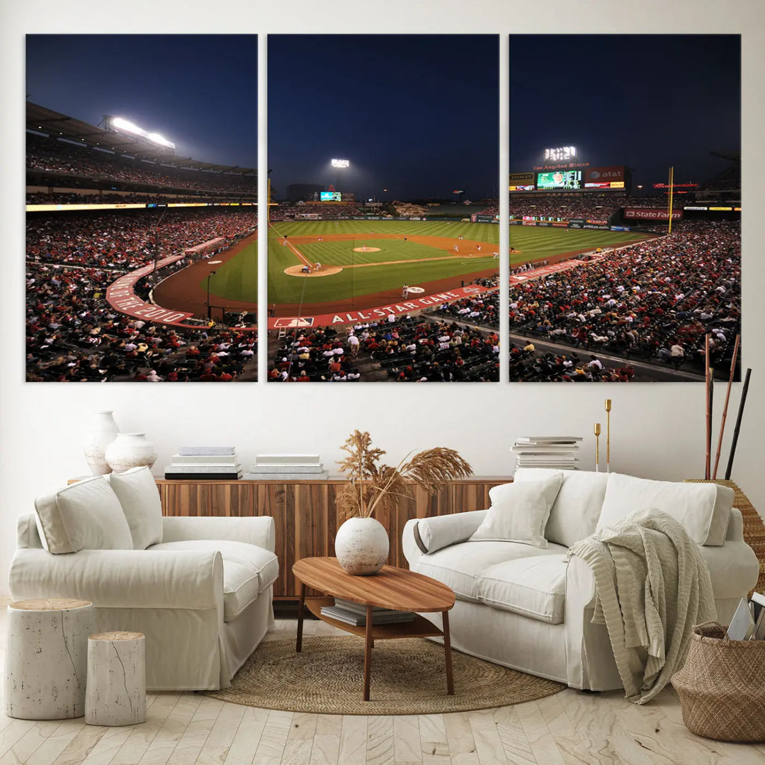 The wall art in the stylish living room features a large triptych of the Anaheim Angel Stadium at night, presented as the Los Angeles Angels Baseball Team Print. This piece is displayed on premium canvas with a gallery-quality finish.