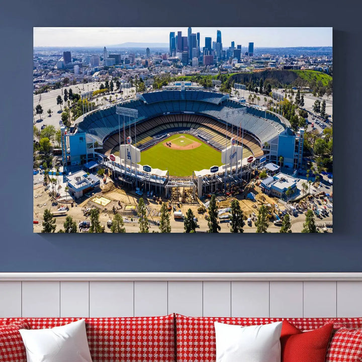 Aerial view of Dodger Stadium, home to the Los Angeles Dodgers, set against a city skyline and featured as a striking wall art piece across three framed panels, offering a gallery-quality finish.