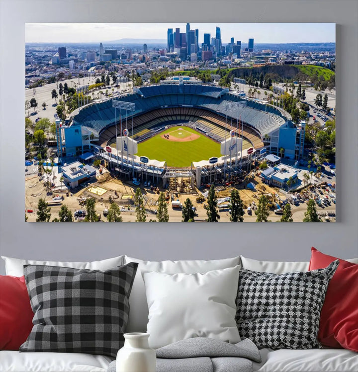 Aerial view of Dodger Stadium, home to the Los Angeles Dodgers, set against a city skyline and featured as a striking wall art piece across three framed panels, offering a gallery-quality finish.