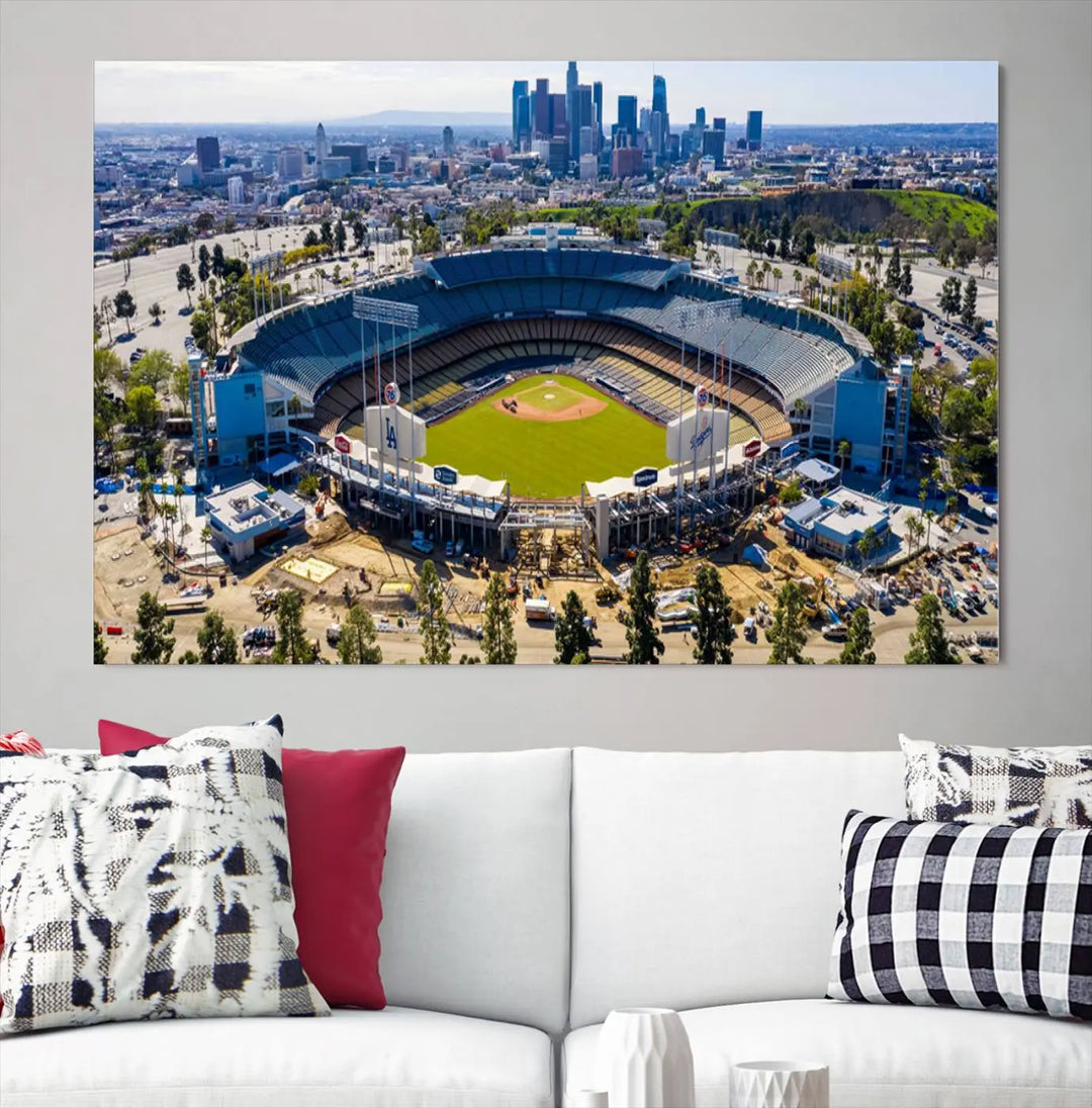 Aerial view of Dodger Stadium, home to the Los Angeles Dodgers, set against a city skyline and featured as a striking wall art piece across three framed panels, offering a gallery-quality finish.