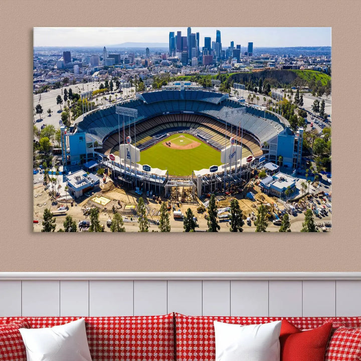 Aerial view of Dodger Stadium, home to the Los Angeles Dodgers, set against a city skyline and featured as a striking wall art piece across three framed panels, offering a gallery-quality finish.