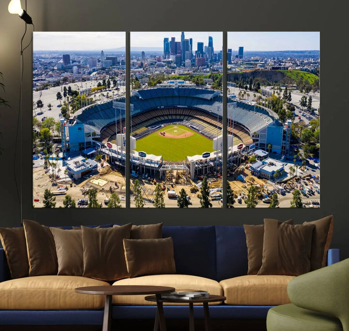 Aerial view of Dodger Stadium, home to the Los Angeles Dodgers, set against a city skyline and featured as a striking wall art piece across three framed panels, offering a gallery-quality finish.