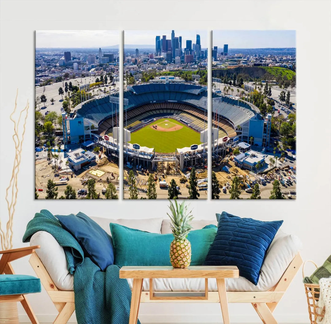 Aerial view of Dodger Stadium, home to the Los Angeles Dodgers, set against a city skyline and featured as a striking wall art piece across three framed panels, offering a gallery-quality finish.