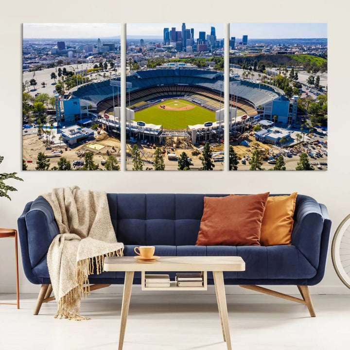 Aerial view of Dodger Stadium, home to the Los Angeles Dodgers, set against a city skyline and featured as a striking wall art piece across three framed panels, offering a gallery-quality finish.