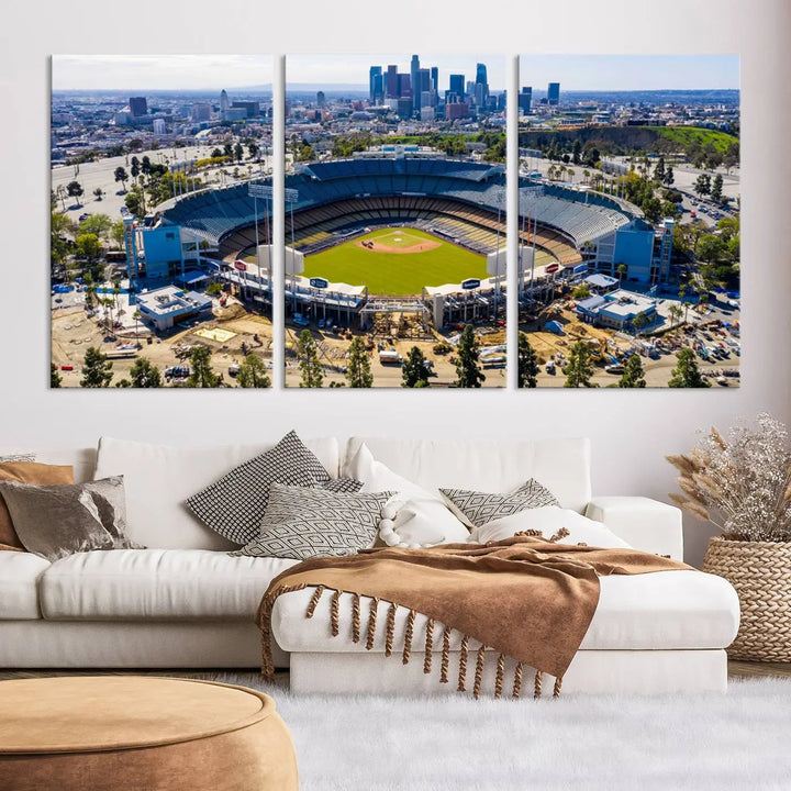 Aerial view of Dodger Stadium, home to the Los Angeles Dodgers, set against a city skyline and featured as a striking wall art piece across three framed panels, offering a gallery-quality finish.