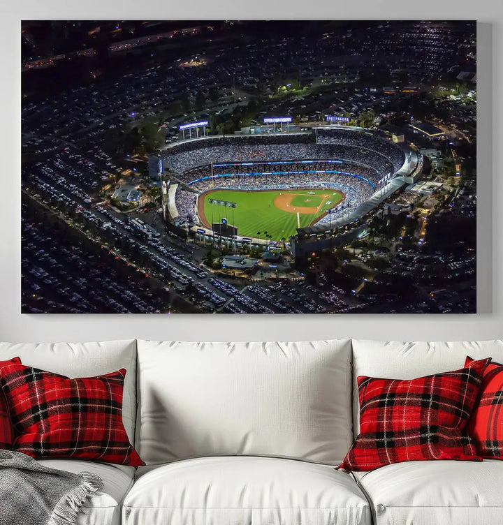 A stunning triptych of Dodger Stadium, captured in a brightly lit aerial view at night, adorns the wall. This Los Angeles Dodgers wall art is crafted with a gallery-quality finish on premium canvas.